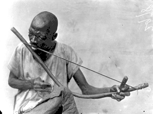 Man playing traditional Music bow. one of the oldest stringed instruments.