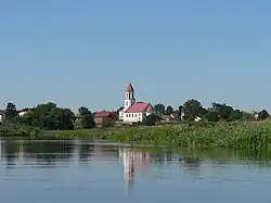 Church of Corpus Christi in Suraż seen from the Narew riverside