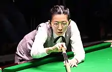 Ng On-yee playing a shot