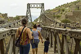 People crossing the bridge