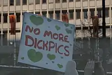 Hand-painted sign at a demonstration