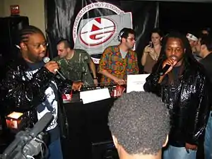 P.M. Dawn performing in 2006 (Left to right: Prince Be and Doc. G)