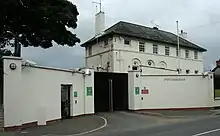 Saintfield P.S.N.I. Station - the Rippingham building is almost hidden by modern defensive walls