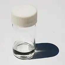 Sample of pivalonitrile in a vial