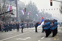 Members of Honour Unit with commandeer Vitomir Petričević presenting the flag of Republika Srpska to former president Milorad Dodik