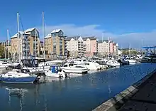 New apartments blocks with boats moored in the marina.