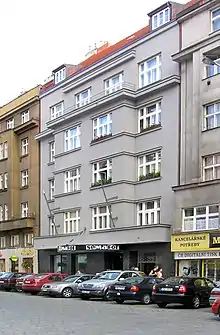 Semafor theatre on ground floor of building, with cars in front