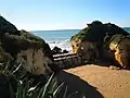 Barrier at the eastern end of the beach constructed to prevent beach erosion.