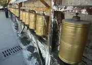 Prayer wheels at the base of the Potala in Lhasa, Tibet.