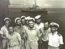 Image 89Australian sailors with a Bathurst-class corvette in the background. The RAN commissioned 56 of this class of corvettes during World War II. (from History of the Royal Australian Navy)