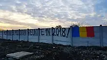 Graffiti in Bucharest. "Romania and Moldova reunited in 2018!".