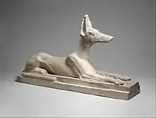 Recumbent Anubis; 664–30 BC; limestone, originally painted black; height: 38.1 cm, length: 64 cm, width: 16.5 cm; Metropolitan Museum of Art