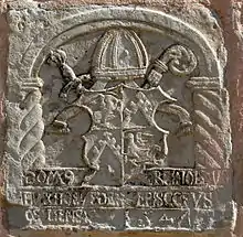 A carved stone with the coat of arms of Reinhold von Buxhoeveden.