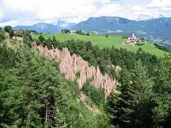 As seen from the west with Nicholas chapel and Dolomites