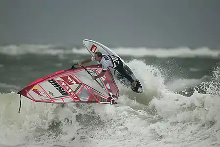 Image 19Robby NaishPhoto credit: Hoch ZweiAmerican windsurfer Robby Naish at the 2006 Windsurf World Cup, off the coast of Sylt, Germany. Naish was one of the first athletes to gain long-lasting international fame as a windsurfer. He won his first overall World Championship title, at the age of 13.More selected pictures