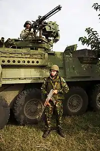 BABADAG TRAINING AREA, Bulgaria - U.S. Soldiers of the 2nd Stryker Cavalry Regiment and Romanian forces of the 33rd Mountain Troop Battalion, Posada train together during the 2009 JTF-East rotation at the Babadag Training Area, Romania.