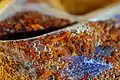 Close-up of a rooibos blend in a tea bag being steeped