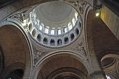 Coupola from below. Each sculpted angel carries a symbol of the passion of Christ.