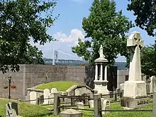 A present-day view of the cemetery with the George Washington Bridge visible in the background.