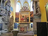 Chancel of the church with altar and baptismal font