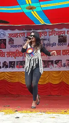 Sashi Rawal singing in a concert