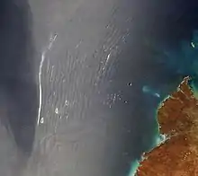 wave clouds observed over the ocean, seen from a satellite