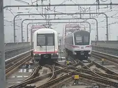 06C01 train on the left and 06C02 train on the right