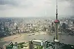 A view from the Jin Mao Tower's Skywalk, showing the Oriental Pearl Tower in Lujiazui and, across the Huangpu River, Shanghai's Bund, Nanjing Road, and the Garden Bridge across Suzhou Creek