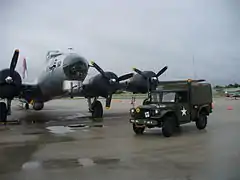 M37 in front of a B-17G operated by the Experimental Aircraft Association.