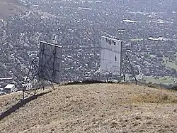 The two microwave radio reflectors directly below the summit. They were removed in late 2013.