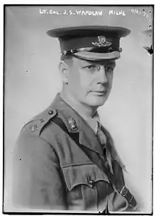 A black and white photo of a man in military uniform