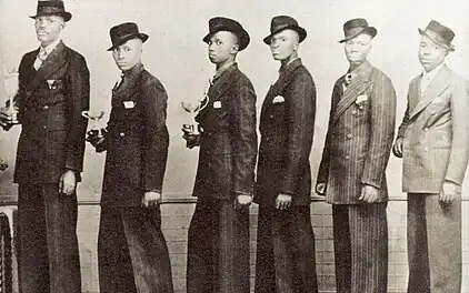 Solomon Linda and the Evening Birds, ca. 1941. From l to r: Solomon Linda, Gilbert Madondo, Boy Sibiya, Gideon Mkhize, Samuel Mlangeni, Owen Sikhakhane