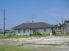 Front of depot, before restoration.  Sign in door states that the depot is owned by the state of Indiana, and that trespassers will be prosecuted.