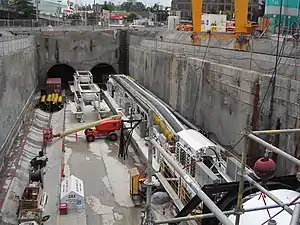 TBM installation apparently required construction of round portals on south side of excavation, June 10, 2006