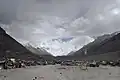 Tent village established for tourists' convenience called Everest Base Camp, in China. It is the furthest that private cars can go. Mount Everest can be seen in the background.