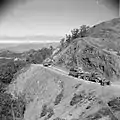 Diamond T tank transporters of the British Army with a load of a Grant ARV, followed by one with a Grant gun tank, in Burma, 1945.