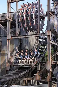 A car passes under the rotating blades