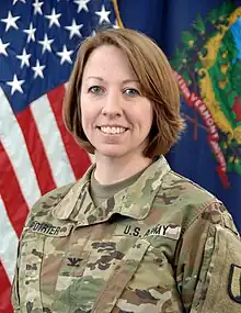 2021 head and shoulders color photo of Brigadier General Tracey Poirier as a colonel, in Operational Camouflage Pattern uniform, facing slightly to her right, looking front