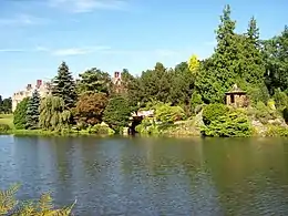 view of lake with summerhouse