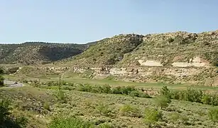 The reclaimed Uravan townsite (at the base of sandstone outcrop) as it appeared in 2008