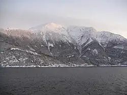 Tjoflot and Oksen in the winter. View from the ferry between Kvanndal and Utne.