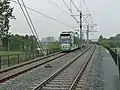 A tram approaching Van Tuyllpark