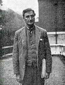 Smartly dressed European man looking towards camera