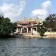 Tam quan  of a temple next to the river