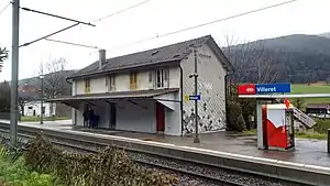 Two-story building with gabled roof