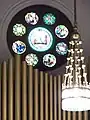 Interior, organ pipes, chandelier.