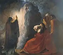  Dramatic painting of a hooded figure raising a ghost as the bearded King clutches his brow