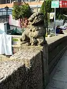 Stone lion on the top of a baluster column