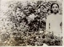 Teenage Ezzat Tabaian in Flower Bed in Isfahan